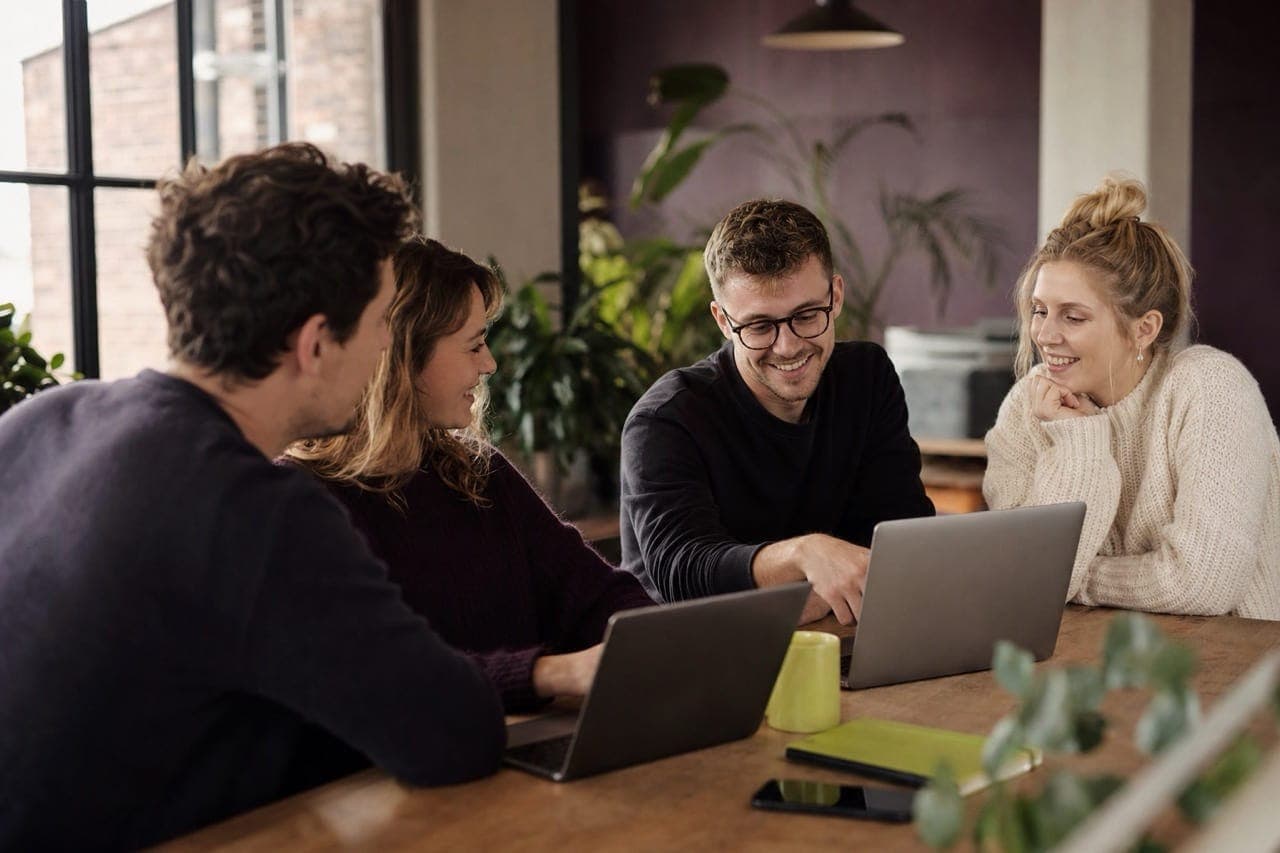 The Digital Marketing Expert team collaborating around a table