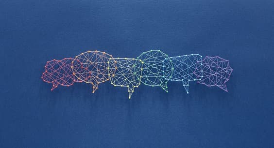 A row of speech bubbles drawn as coloured wireframe outlines on a blue background.