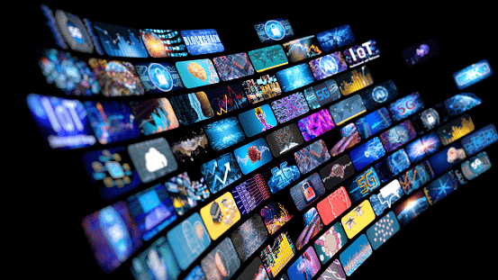 A curving wall of streaming video and media thumbnails against a black background.