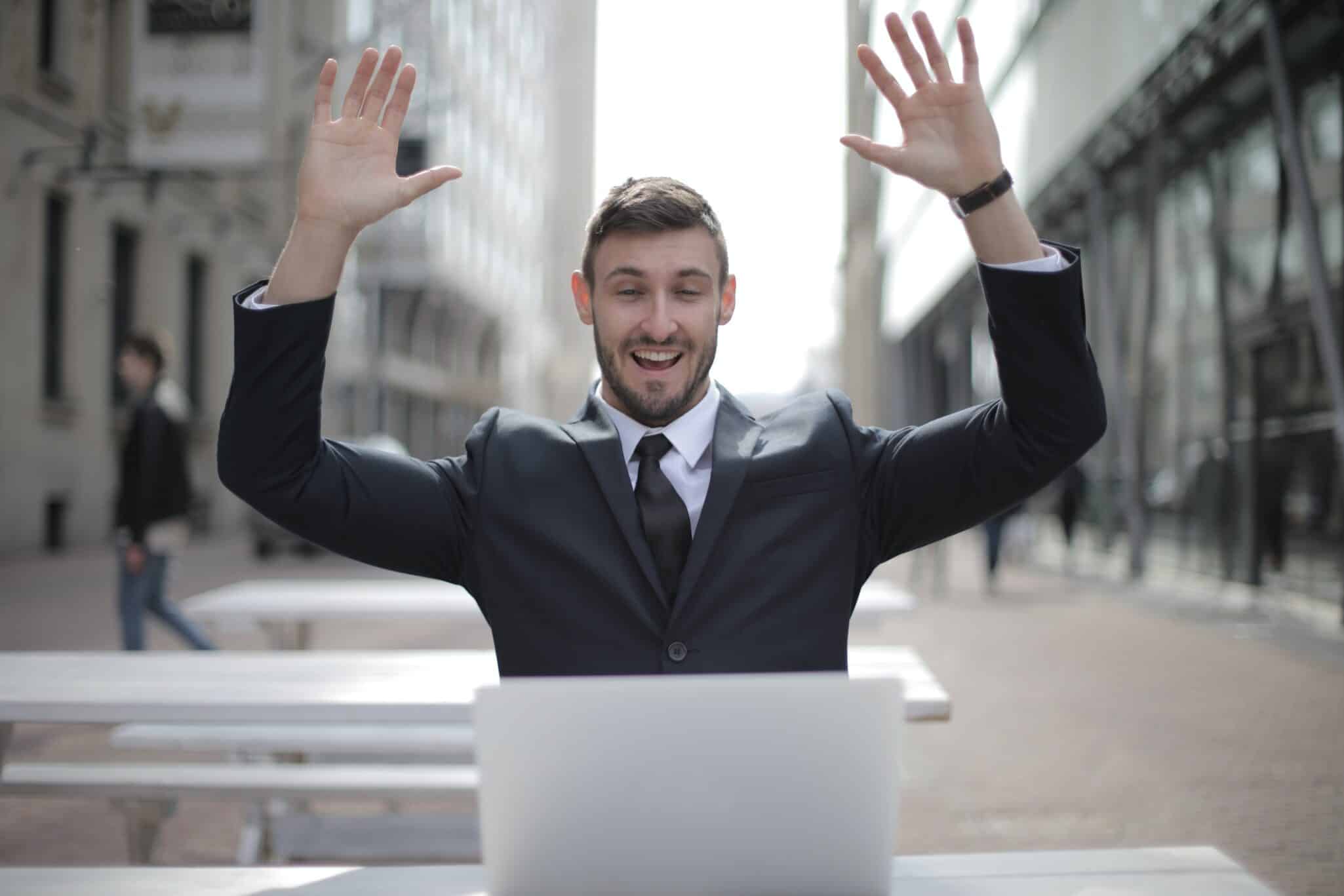Businessman working on laptop looking happy